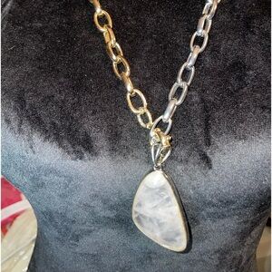 Quartz pendant with silver and gold tones necklace